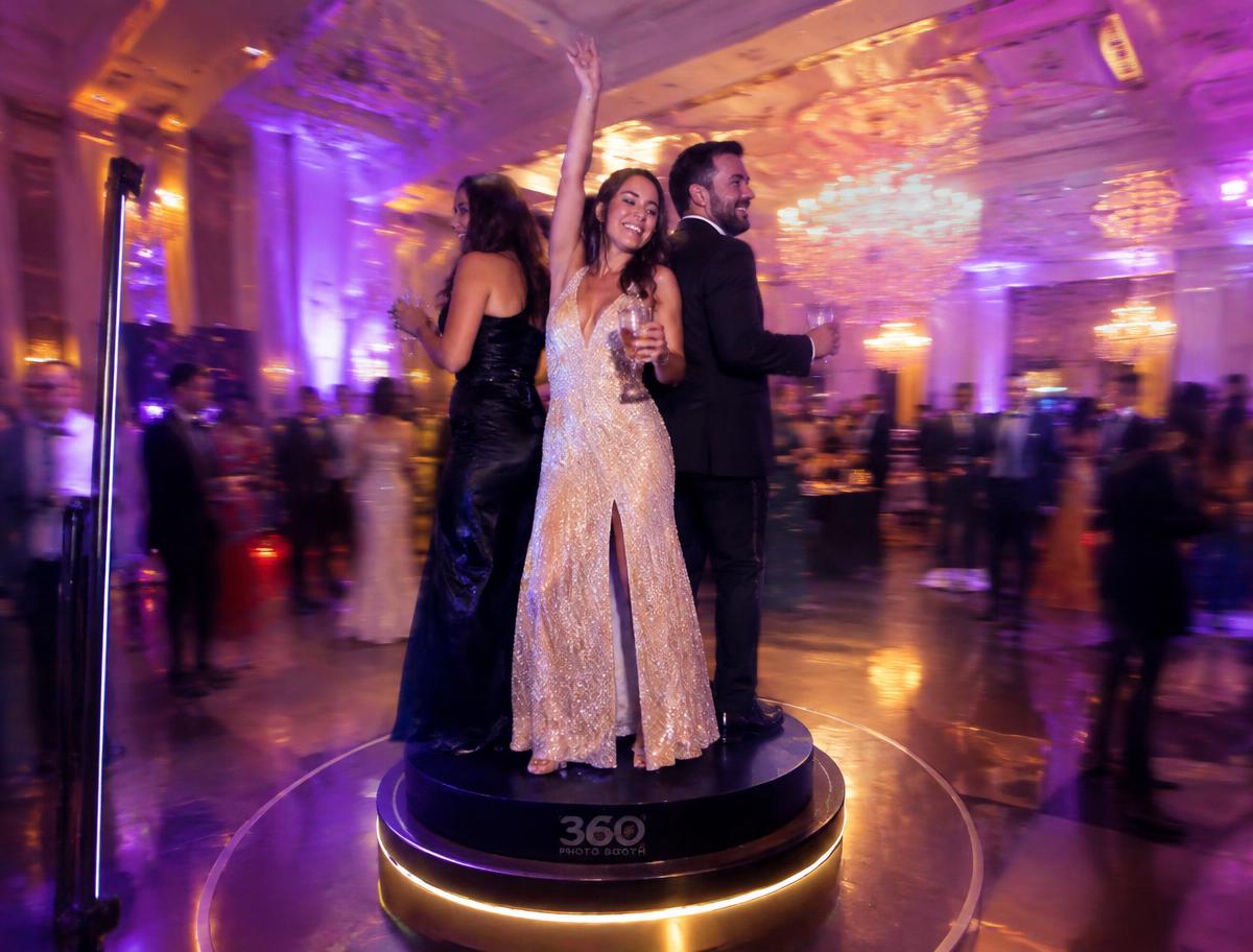 Guests on a 360 photo booth platform