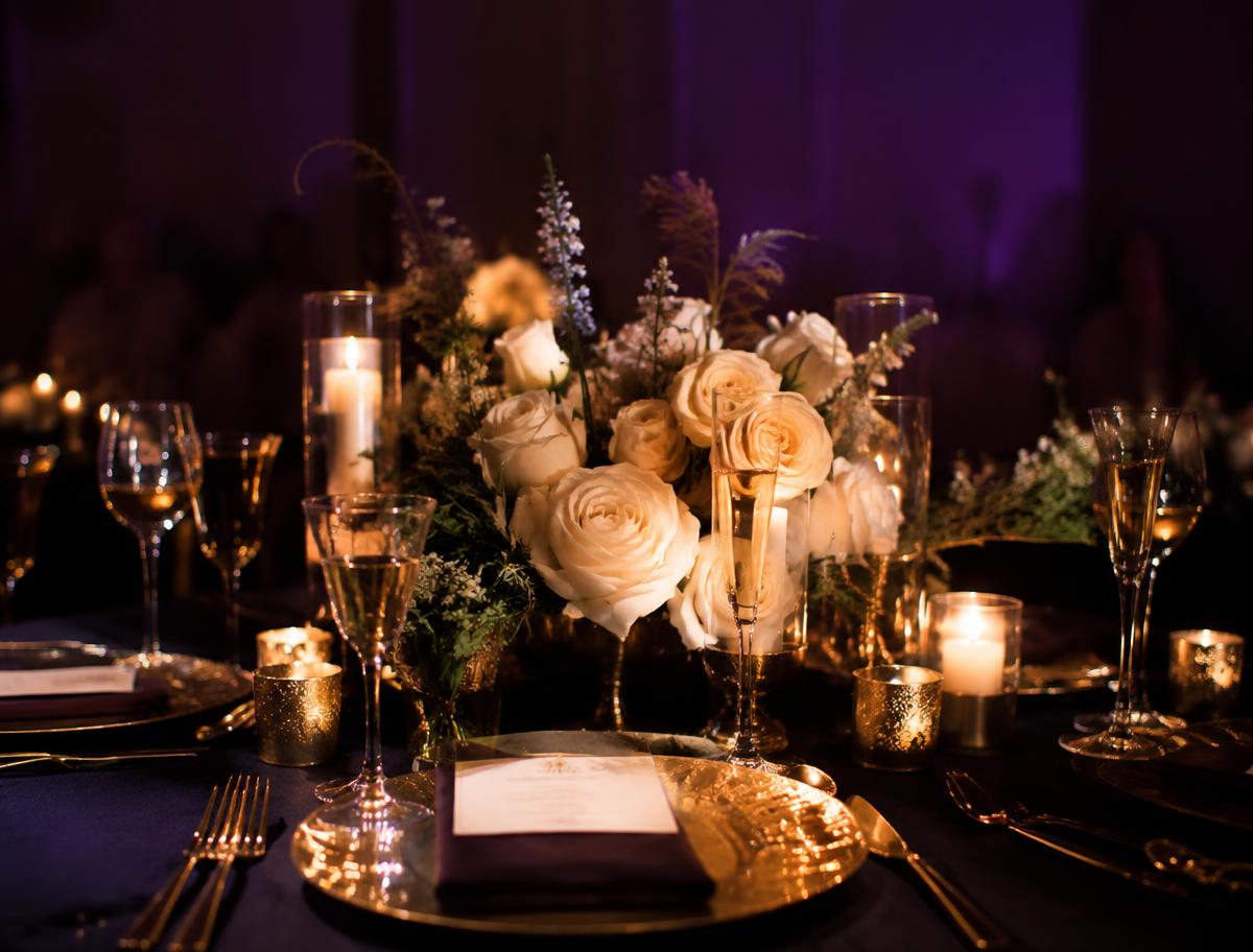 Candlelit reception table with cream roses